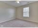 Neutrally decorated bedroom with carpet, a ceiling fan, and a window, providing ample natural light at 820 Scotch Pine Dr, Greenwood, IN 46143