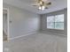 Bright bedroom with neutral walls, soft carpeting, and a large window at 820 Scotch Pine Dr, Greenwood, IN 46143