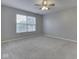 Spacious bedroom with neutral carpeting, ample natural light, and a ceiling fan at 820 Scotch Pine Dr, Greenwood, IN 46143