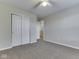 Bedroom with neutral carpet, closet, and a view to another room, offering a comfortable living space at 820 Scotch Pine Dr, Greenwood, IN 46143