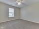 Neutral bedroom featuring carpet, a ceiling fan, and a window, providing ample natural light at 820 Scotch Pine Dr, Greenwood, IN 46143