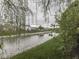 Canal view highlighting the lush green vegetation and adjacent homes at 820 Scotch Pine Dr, Greenwood, IN 46143