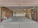Spacious garage with unfinished walls, cabinetry, and concrete flooring at 820 Scotch Pine Dr, Greenwood, IN 46143