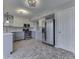 Well-lit kitchen featuring gray cabinets, modern appliances, and decorative ceiling lighting at 820 Scotch Pine Dr, Greenwood, IN 46143