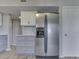Modern kitchen design showcases stainless steel appliances and gray cabinets near a white door at 820 Scotch Pine Dr, Greenwood, IN 46143