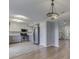 Open-concept kitchen featuring stainless steel appliances, white cabinets, and a brick-patterned floor at 820 Scotch Pine Dr, Greenwood, IN 46143
