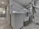 Well-lit laundry room featuring a modern washer and dryer, with a shelf for storage, plus the HVAC system at 820 Scotch Pine Dr, Greenwood, IN 46143