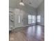 Bright living room with hardwood floors, large windows, and vaulted ceiling for a spacious feel at 820 Scotch Pine Dr, Greenwood, IN 46143
