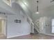 Bright living space with hardwood flooring, and an open staircase at 820 Scotch Pine Dr, Greenwood, IN 46143