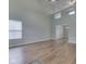 Spacious living room with hardwood floors, bright windows, and vaulted ceilings at 820 Scotch Pine Dr, Greenwood, IN 46143