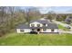 Aerial view of a home showcasing its lawn, well-kept landscaping, siding, roof, and neighborhood at 8315 N Payne Rd, Indianapolis, IN 46268