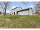 Spacious backyard featuring lush lawn and mature trees, perfect for outdoor enjoyment at 8315 N Payne Rd, Indianapolis, IN 46268