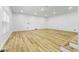 Basement area featuring hardwood floors, recessed lights, and a bright, open space at 8315 N Payne Rd, Indianapolis, IN 46268