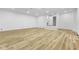 Spacious basement with wooden flooring and access to another room at 8315 N Payne Rd, Indianapolis, IN 46268