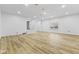 Spacious basement with hardwood floors, recessed lighting, and neutral wall paint at 8315 N Payne Rd, Indianapolis, IN 46268