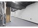 Spacious basement with open layout featuring a furnace, mechanical equipment, and painted surfaces at 8315 N Payne Rd, Indianapolis, IN 46268