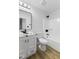 Well-lit bathroom featuring white fixtures and black hardware, creating a modern aesthetic at 8315 N Payne Rd, Indianapolis, IN 46268