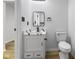 Bathroom with a stylish vanity and toilet, featuring a modern design with sleek fixtures at 8315 N Payne Rd, Indianapolis, IN 46268