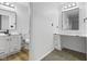 Bathroom featuring dual vanity sinks, a makeup vanity, and modern fixtures at 8315 N Payne Rd, Indianapolis, IN 46268