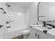 Bathroom with shower/tub combo, single sink vanity with storage and modern fixtures at 8315 N Payne Rd, Indianapolis, IN 46268