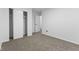 Carpeted bedroom featuring a closet and door, offering a calm and private space at 8315 N Payne Rd, Indianapolis, IN 46268