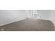 Neutral bedroom featuring new carpet, fresh paint, and doorway to bathroom at 8315 N Payne Rd, Indianapolis, IN 46268