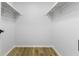 Bright, empty walk-in closet featuring wood floor and shelving, ready for customization at 8315 N Payne Rd, Indianapolis, IN 46268