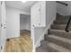 Entryway with hardwood floors, carpeted stairs, and neutral wall paint at 8315 N Payne Rd, Indianapolis, IN 46268
