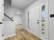 Bright entryway features modern finishes, sleek fixtures, and hardwood flooring at 8315 N Payne Rd, Indianapolis, IN 46268
