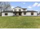 Charming two-story home with painted brick, wood accents, and a well-manicured lawn at 8315 N Payne Rd, Indianapolis, IN 46268
