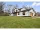 Charming two-story home with painted brick, wood accents, and a well-manicured lawn at 8315 N Payne Rd, Indianapolis, IN 46268
