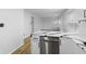 Open kitchen view showcasing white cabinets, black hardware, and stainless steel dishwasher at 8315 N Payne Rd, Indianapolis, IN 46268