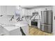 Modern kitchen featuring quartz countertops, white cabinets, and stainless steel appliances at 8315 N Payne Rd, Indianapolis, IN 46268