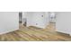 View of the living room showcasing hardwood floors and connecting stairway to the upper level at 8315 N Payne Rd, Indianapolis, IN 46268