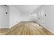 Bright living room with hardwood floors, white walls, and a glass door leading to the outside at 8315 N Payne Rd, Indianapolis, IN 46268