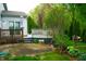 The patio and deck in the backyard are perfect for entertaining and relaxation in a verdant, landscaped setting at 8727 Redditch Dr, Avon, IN 46123