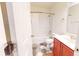Bathroom boasts a shower with curtain, patterned tile floors, toilet, and modern sink at 8727 Redditch Dr, Avon, IN 46123