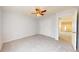 Bright bedroom with a ceiling fan, gray carpet, and a view of the loft area at 8727 Redditch Dr, Avon, IN 46123