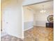 The dining room features hard surface flooring, white walls and views into other rooms of the home at 8727 Redditch Dr, Avon, IN 46123