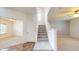 Bright foyer boasts tile flooring, a staircase, and leads to the main living area at 8727 Redditch Dr, Avon, IN 46123