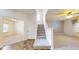 Bright foyer boasts tile flooring, a staircase, and leads to the main living area at 8727 Redditch Dr, Avon, IN 46123