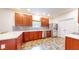 The open kitchen features wood cabinets, stainless appliances and stone countertops at 8727 Redditch Dr, Avon, IN 46123