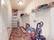 Functional laundry room with shelving for storage and vinyl flooring at 8727 Redditch Dr, Avon, IN 46123
