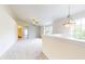 Open loft area with neutral walls, carpet, and a ceiling fan at 8727 Redditch Dr, Avon, IN 46123