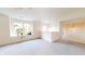 Bright loft area with neutral walls, carpet, and an abundance of natural light from a large window at 8727 Redditch Dr, Avon, IN 46123