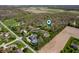 Aerial view displaying the neighborhood and beautiful homes with the property pin-dropped at 923 Woodcrest Way, Anderson, IN 46012