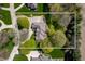 Expansive aerial view showcasing the home's layout, surrounding greenery, and lot size at 923 Woodcrest Way, Anderson, IN 46012