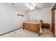 Cozy bedroom with sloped ceilings, a wooden bed frame, and neutral-toned walls at 923 Woodcrest Way, Anderson, IN 46012