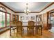 Formal dining room with hardwood floors, chandelier, and natural light at 923 Woodcrest Way, Anderson, IN 46012