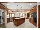Spacious kitchen with a center island, stainless steel appliances, and custom cabinetry at 923 Woodcrest Way, Anderson, IN 46012
